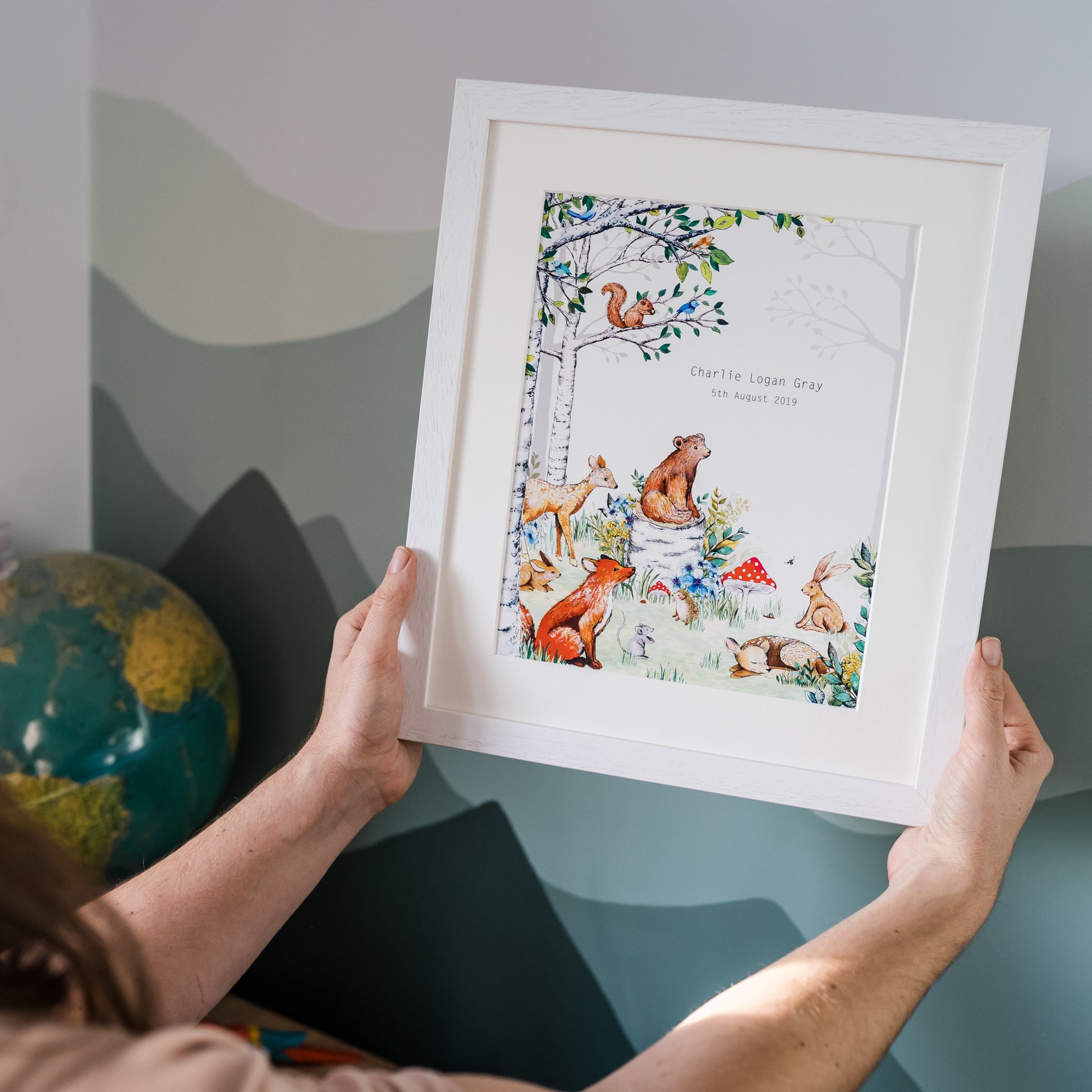 A Personalised Woodland Animals Nursery Print hand painted and illustrated by Charlotte Jones Design.  